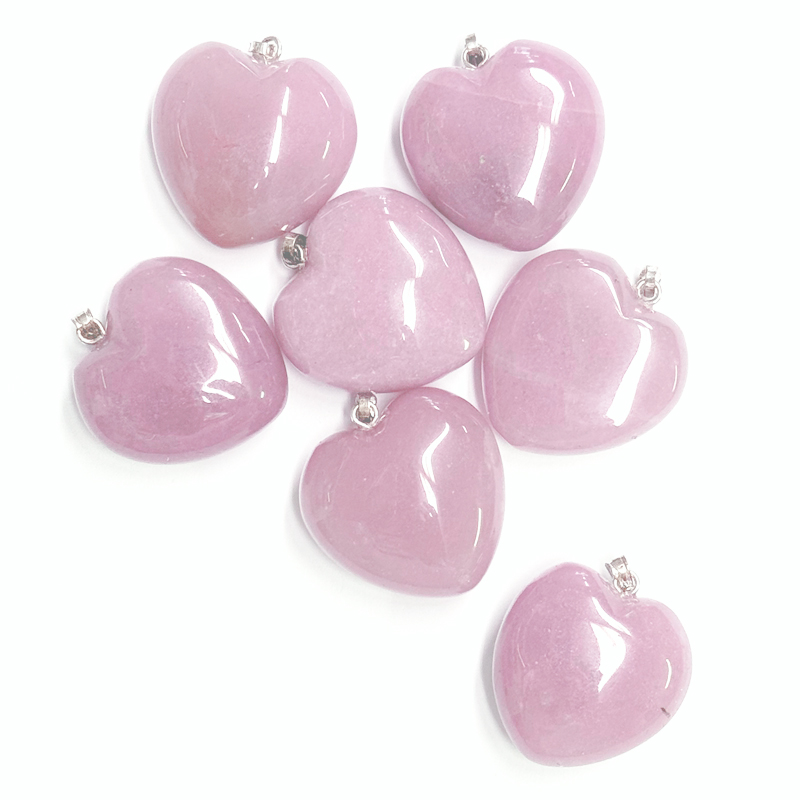 Rose Quartz Heart Pendant Pile of Rose Quartz Heart Pendants