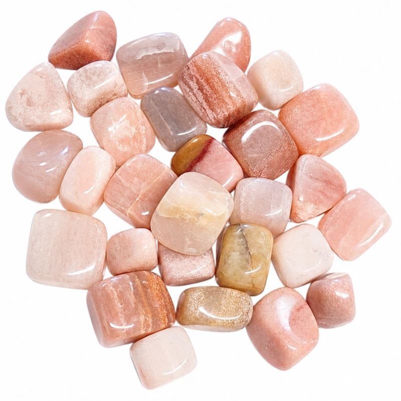 Tumbled pink aventurine stones Pile of tumbled pink aventurine stones